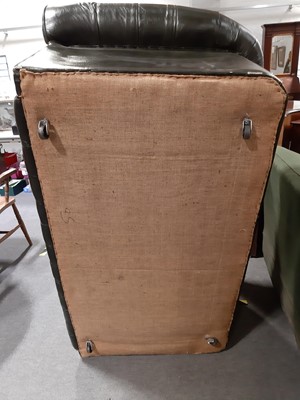 Lot 411 - A modern two-seater leather settee in the Chesterfield style