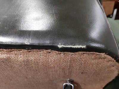 Lot 411 - A modern two-seater leather settee in the Chesterfield style