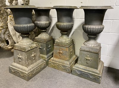 Lot 331 - A set of four cast metal campagna shape garden urns, late 20th Century