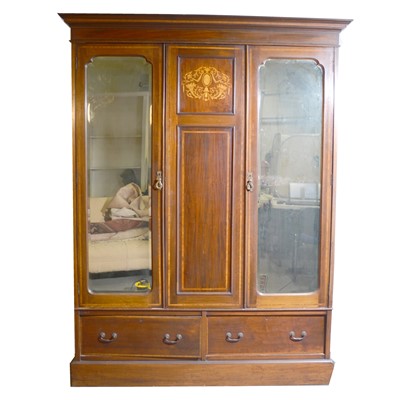 Lot 444 - An Edwardian inlaid mahogany triple wardrobe.