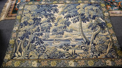 Lot 481 - A machine made verdure tapestry.