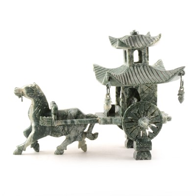 Lot 192 - A green and white hard stone carving of a horse pulling an elderly man in a pagoda carriage.