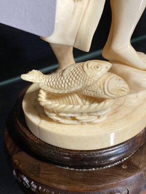 Lot 40 - A Japanese carved ivory okimono, Meiji