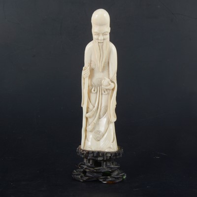 Lot 272 - A Japanese carved ivory okimono, modelled as an elder