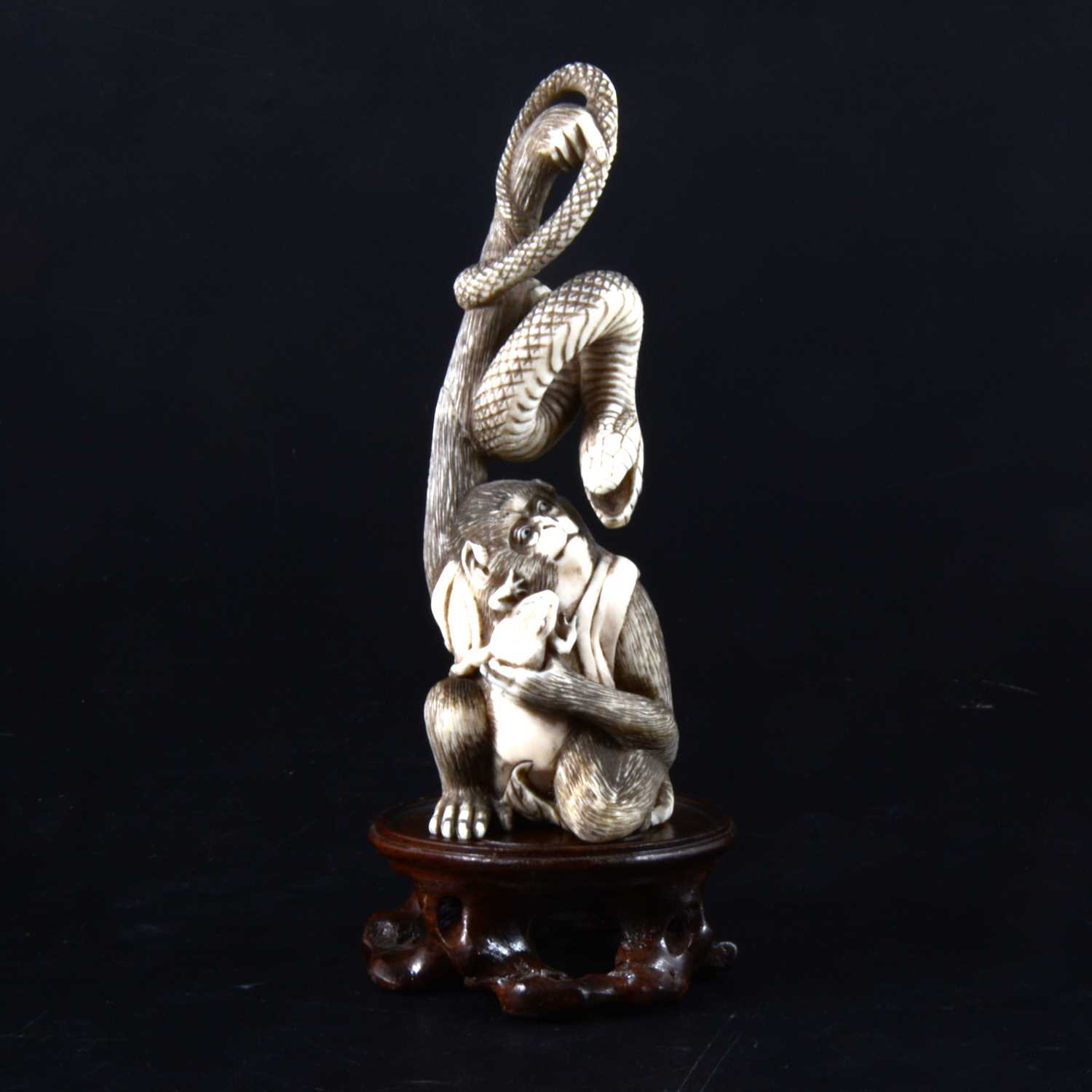 Lot 49 - A Japanese carved and stained ivory group, early 20th Century