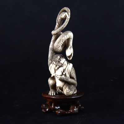 Lot 49 - A Japanese carved and stained ivory group, early 20th Century