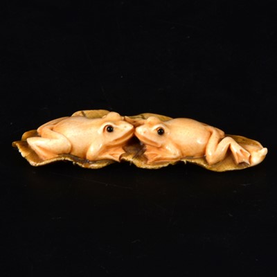 Lot 58 - A Japanese carved and stained ivory netsuke, probably early 20th Century
