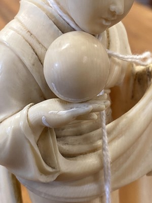 Lot 59 - A Japanese carved ivory okimono, probably early 20th Century
