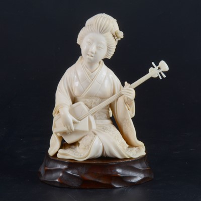 Lot 64 - A Japanese carved ivory okimono, Meiji