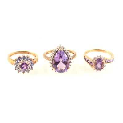 Lot 335 - Three amethyst dress rings all set in 9 carat yellow and white gold.