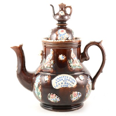 Lot 9 - A large bargeware teapot, inscribed and dated 1906