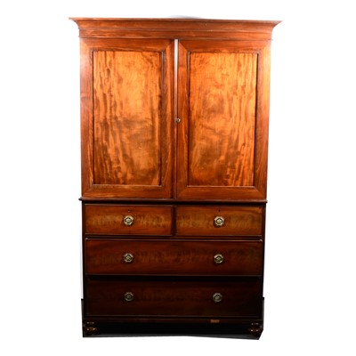 Lot 609 - A Victorian mahogany linen press, cavetto...