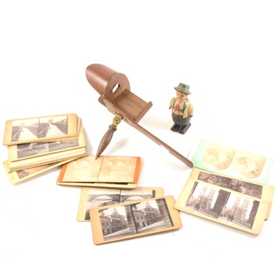 Lot 165 - A stereoscopic viewer with a quantity of cards, and a walking toy figure
