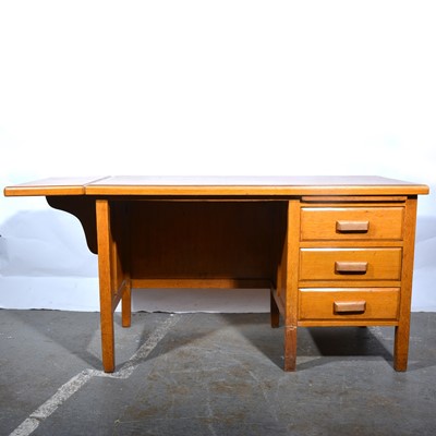 Lot 150 - Two light oak office tables/ desks, early 20th century.