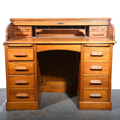 Lot 127 - An Edwardian oak rolltop desk, by Lebus.