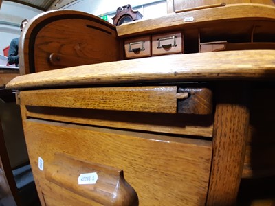 Lot 127 - An Edwardian oak rolltop desk, by Lebus.