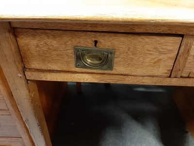 Lot 126 - An oak single pedestal desk.