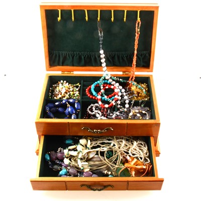 Lot 328 - A wooden jewel box of natural stone and freshwater pearl necklaces and bracelets.