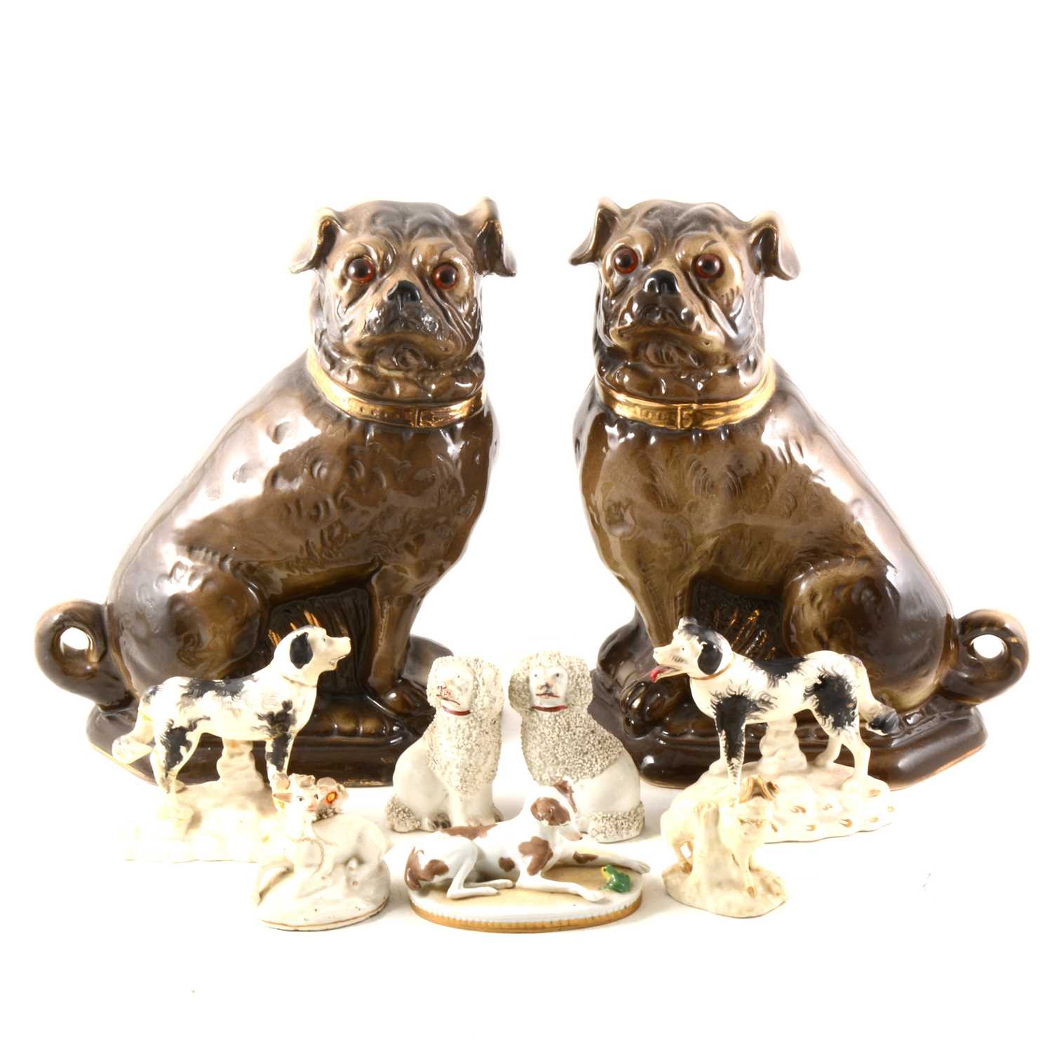 Lot 52 - A pair of Staffordshire style Pugs, and other dog figures.