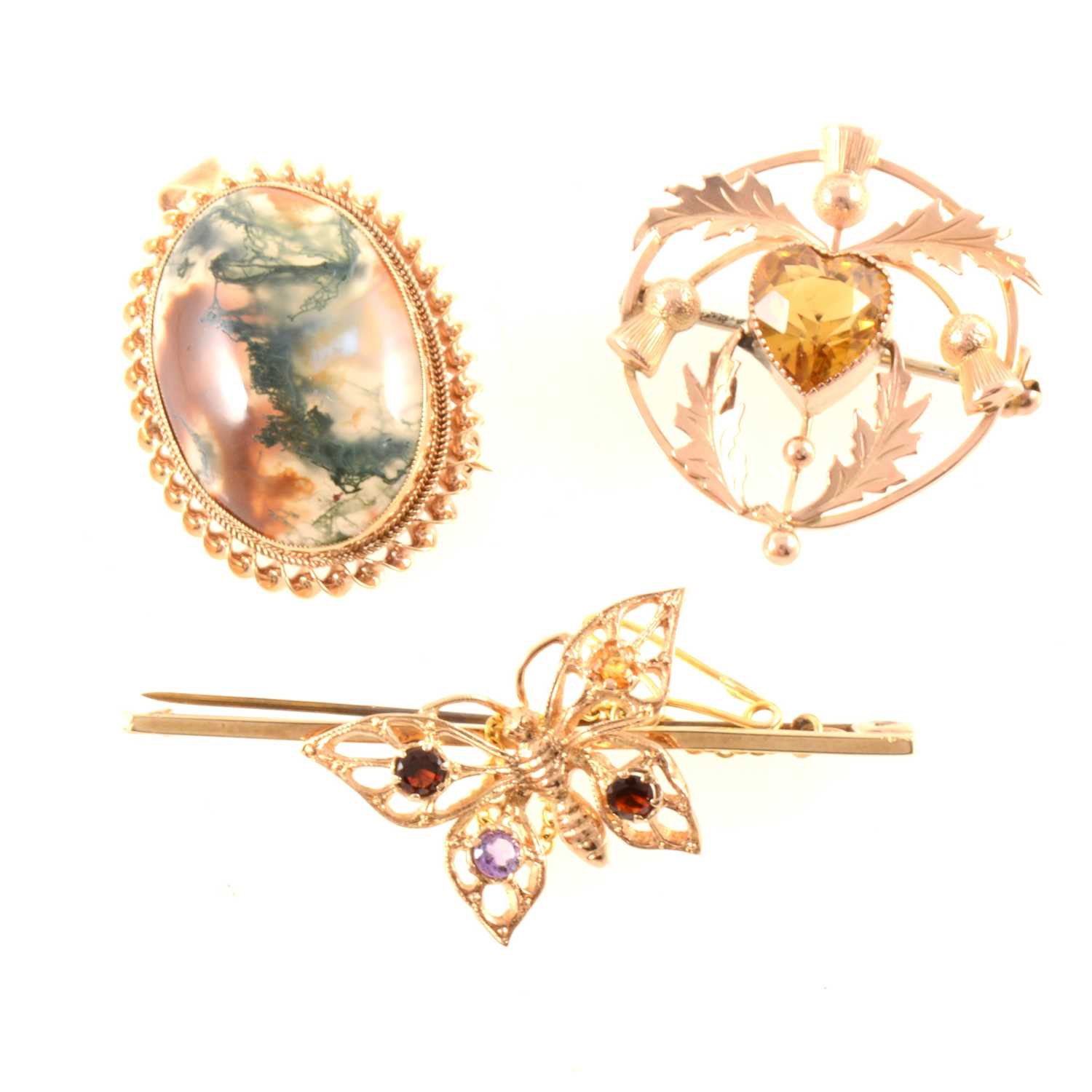 Lot 358 - Three vintage gold brooches.