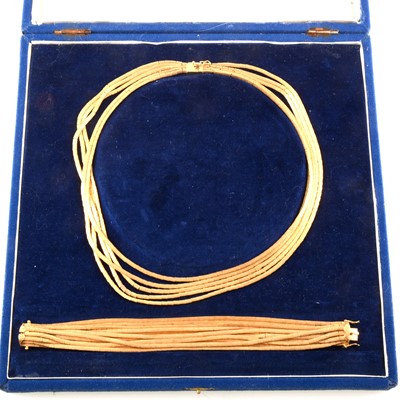 Lot 378A - A yellow metal necklace and bracelet suite marked 750.