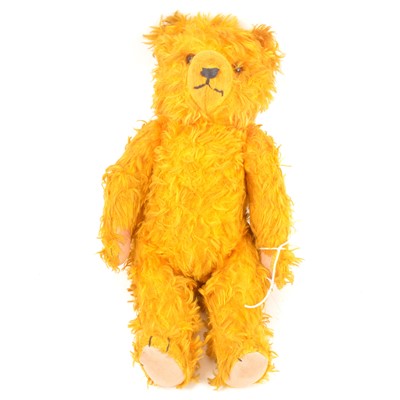 Lot 34 - A Herman teddy bear, long golden hair, c1950s, straw filled, with growler, jointed limbs, 34cm tall.