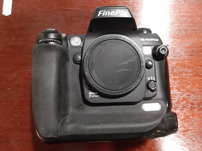 Lot 168 - Three digital SLR cameras; including Fujifilm...