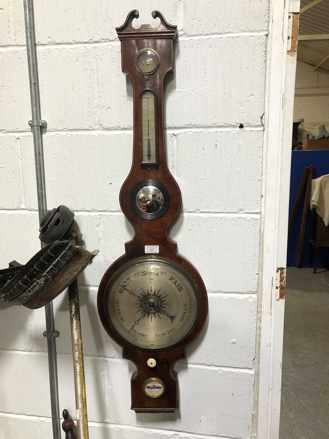 Lot 622 A Regency mahogany banjo shape barometer,