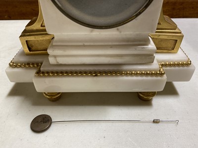 Lot 237 - A Louis XVI ormolu and white marble mantel clock