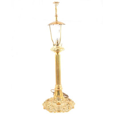 Lot 528 - Cast brass table lamp, eagle finial, scrolled and fluted base, height 77cm.