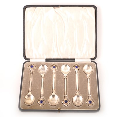 Lot 525 - A cased set of six Arts and Crafts silver cabochon set teaspoons, by Harold Edwin Landon of Lancaster