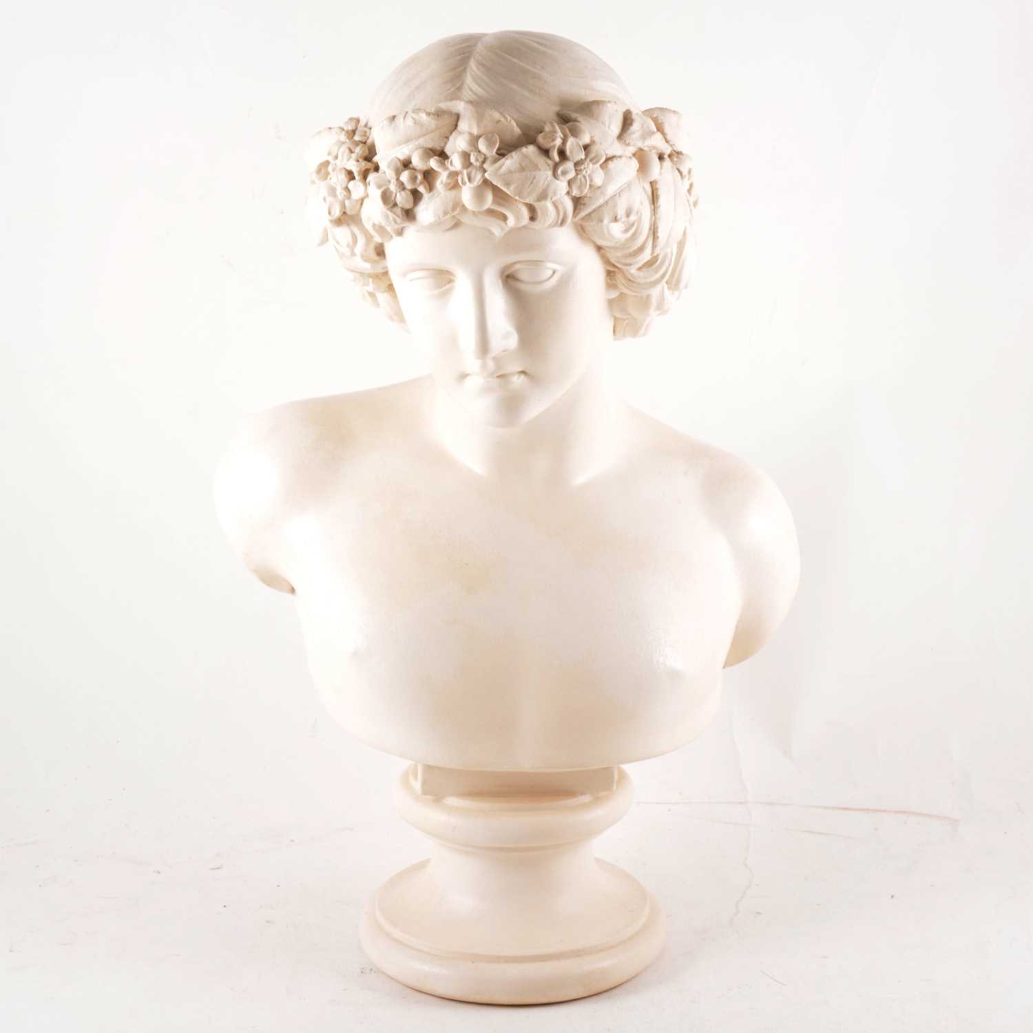 Lot 66 - A composition white painted bust of Bacchus