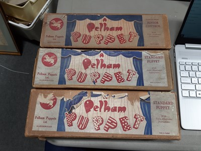 Lot 13 - Pelham Puppets; four including black poodle, police man, girl and Muffin the Mule, all boxed.