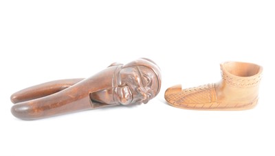 Lot 123 - A Scandinavian carved shoe and continental mask nutcracker