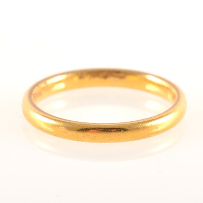 Lot 233 - A 22 carat yellow gold wedding band.