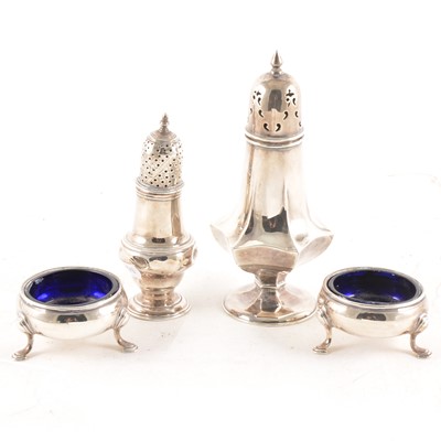 Lot 190 - A pair of silver cauldron salts with blue glass liners and two sugar casters.