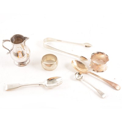 Lot 197 - A collection of silver napkin rings, sugar nips, condiment spoons, small sparrow beak jug etc.