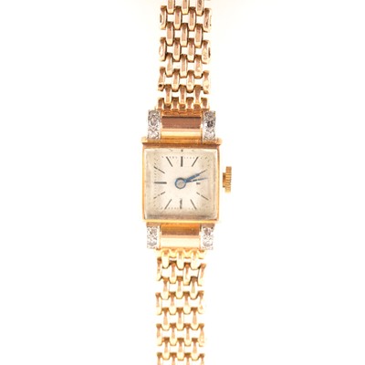 Lot 291 - Bucherer - a lady's yellow metal bracelet watch marked 750 18K