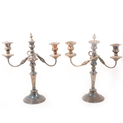 Lot 130 - A pair of electroplated three-light candelabra.