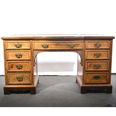 Lot 425 - An Edwardian oak and grained walnut bowfront dressing table.