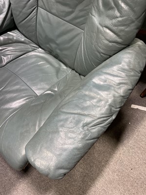 Lot 405 - A pair of 'Stressless' leather adjustable easy chairs, with stools, and a two-seat sofa.