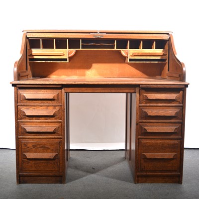 Lot 462 - An Edwardian oak roll-top desk.