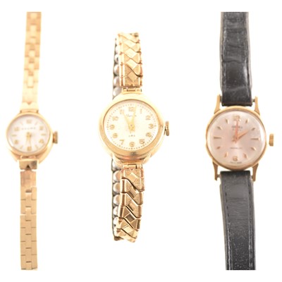 Lot 294 - Baume - a lady's 9 carat yellow gold bracelet watch and two other gold cased wristwatches.