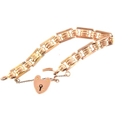 Lot 252 - A rose metal bar link bracelet with padlock fastener.