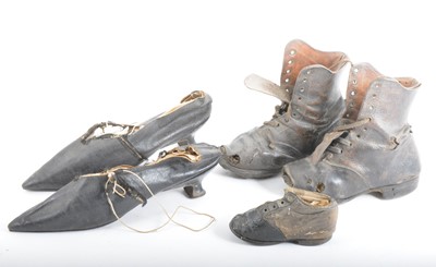 Lot 127 - A pair of old and worn child's boots