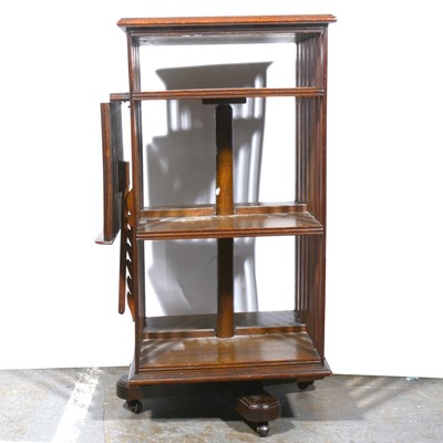 Lot 561 - An Edwardian oak revolving library boocase