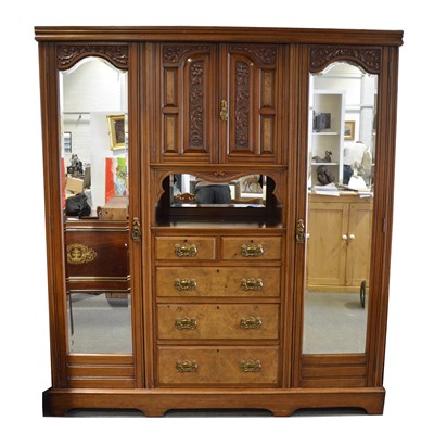 Lot 555 - A late Victorian walnut triple wardrobe