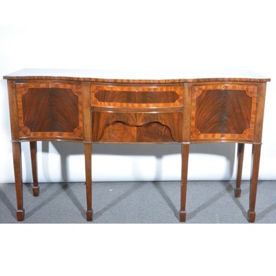 Lot 420 - A reproduction mahogany and satinwood serpentine sideboard