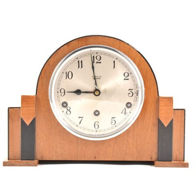 Lot 161 - An Art Deco walnut and ebonised mantel clock