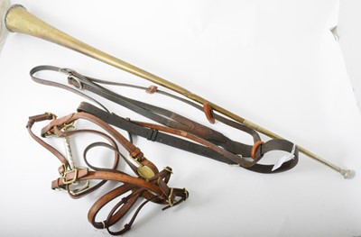 Lot 125 - A post/coaching horn in original leather holder, 90cm, a cob-size in hand show bridle and a martingale.